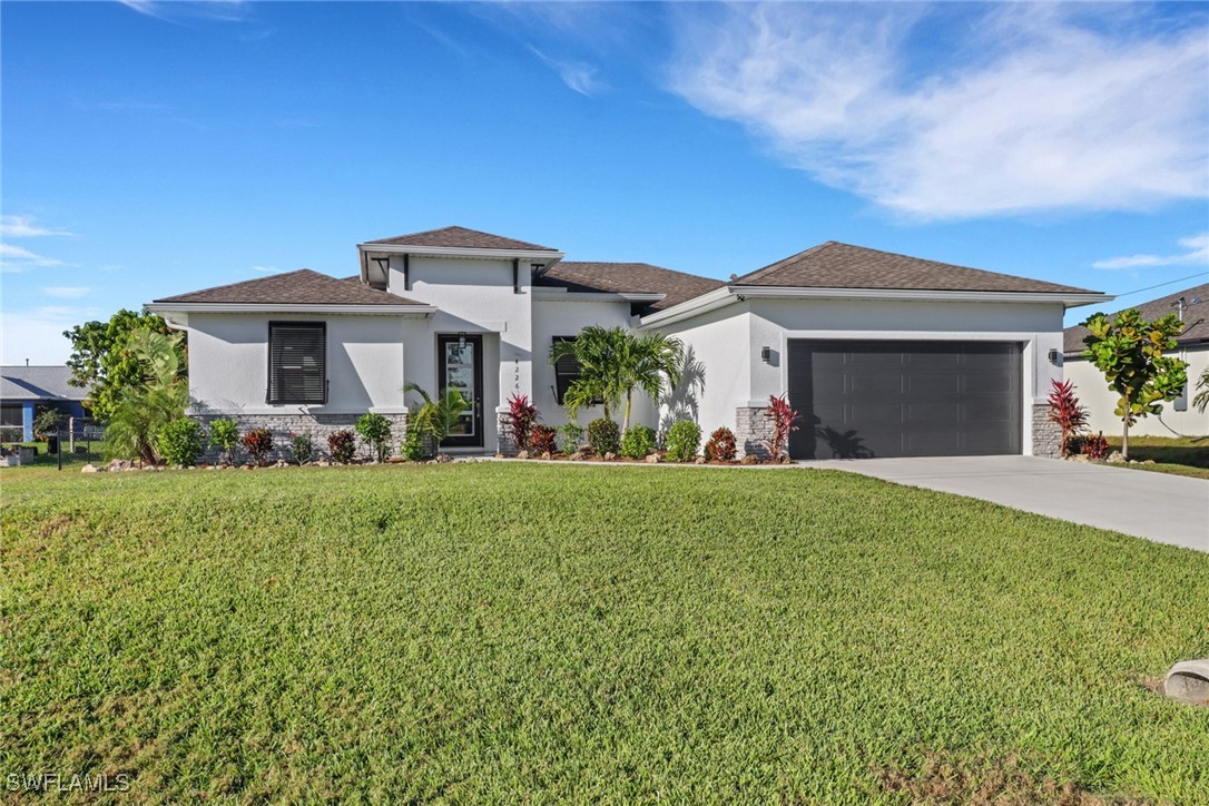 front view of a house with a yard