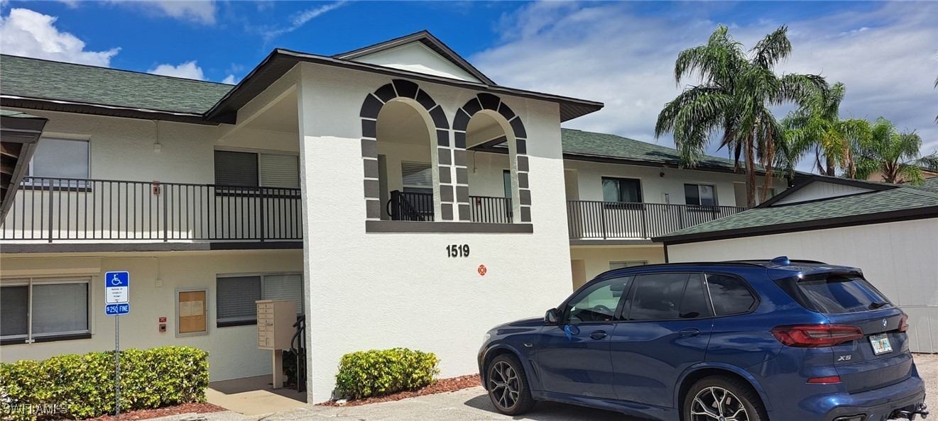 a front view of a house with parking