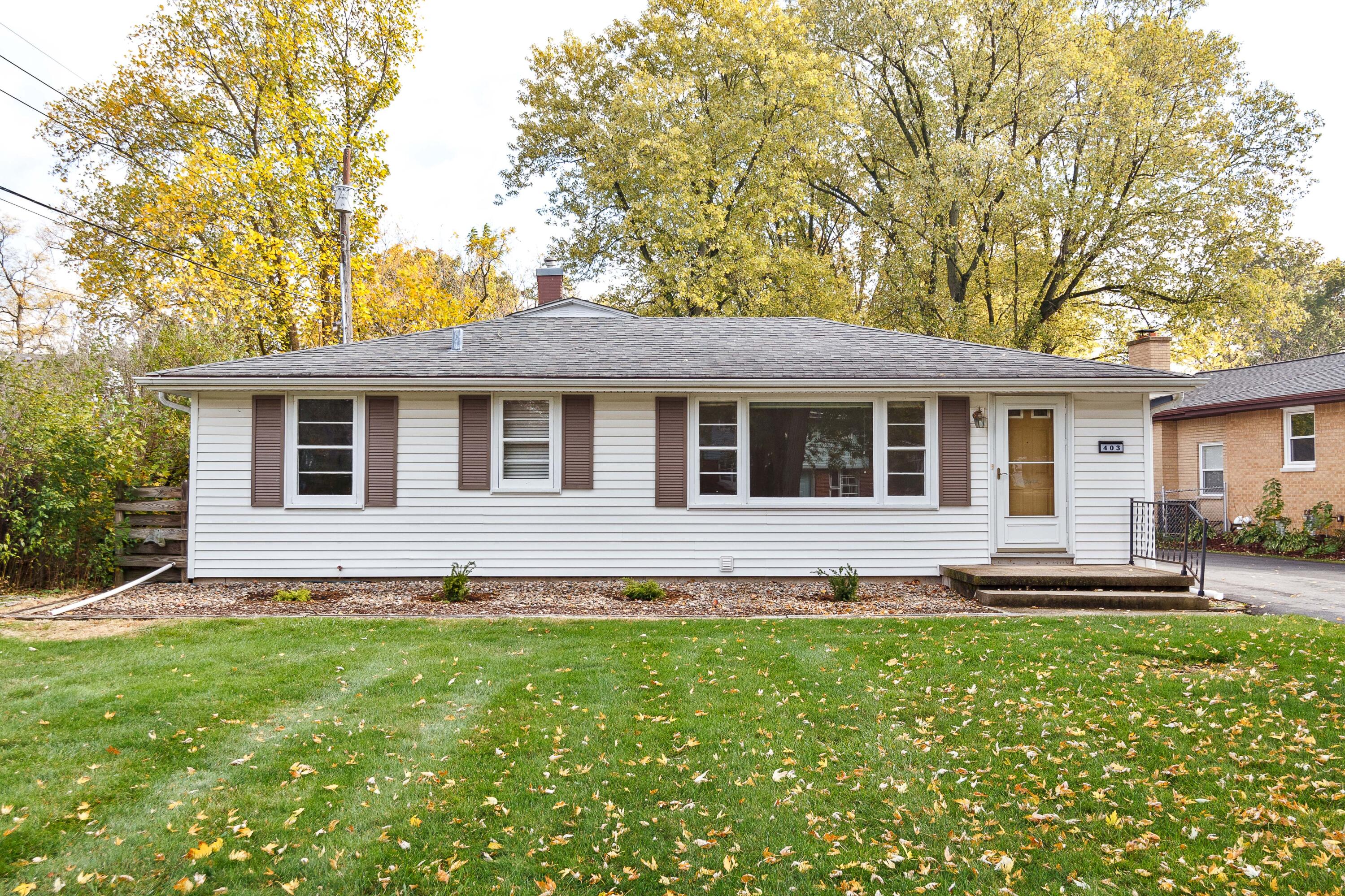 front view of a house with a yard