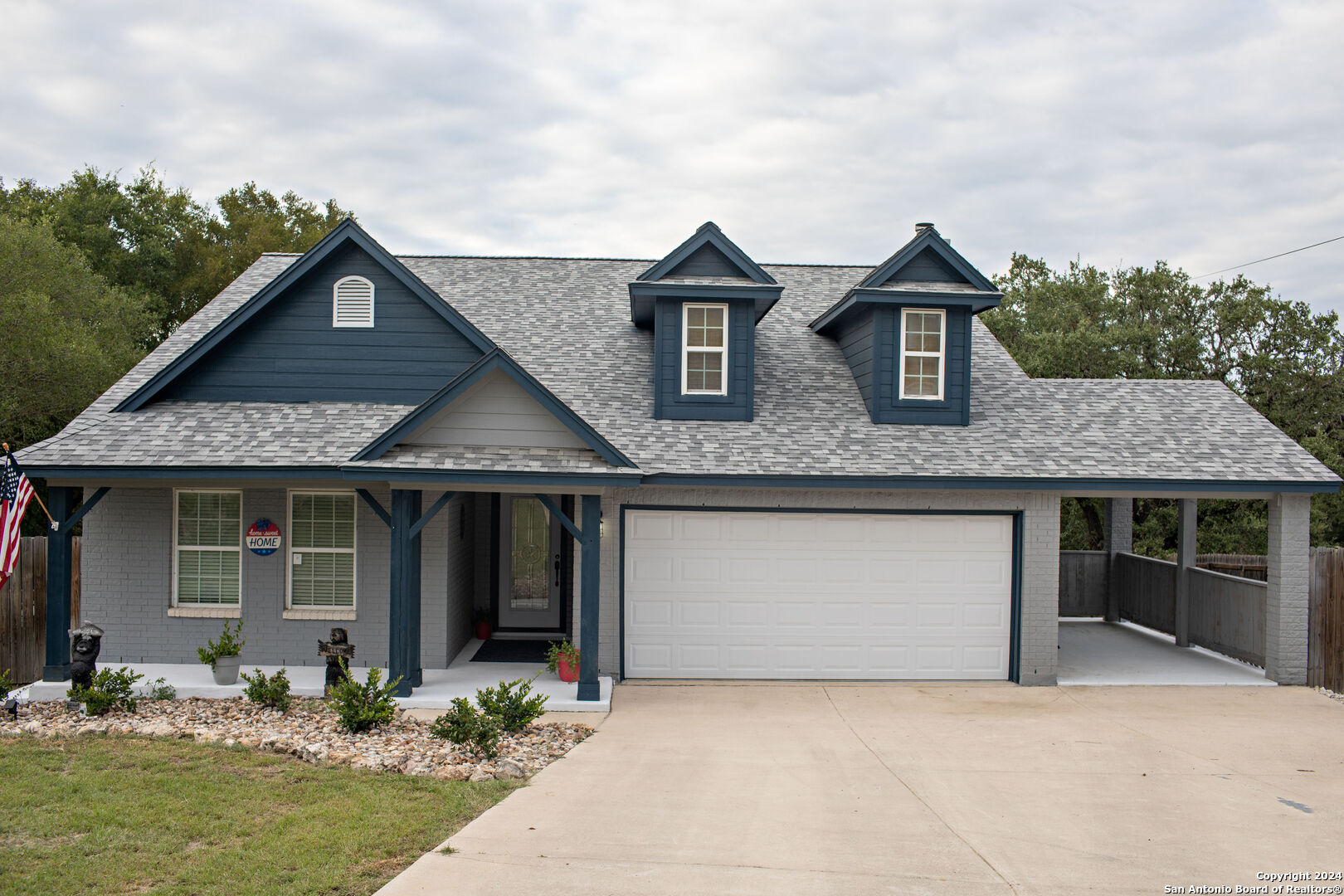 a front view of a house with garden