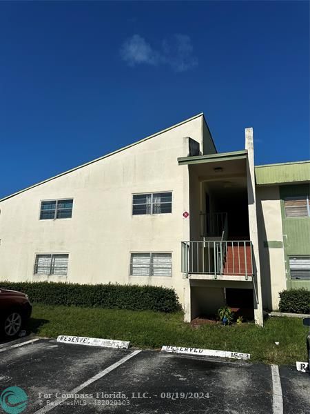 a view of house with backyard