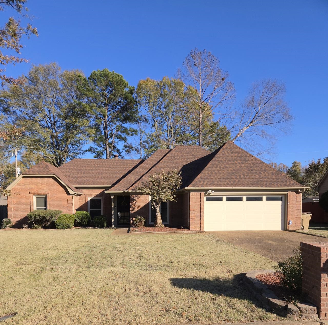 a front view of a house with a yard