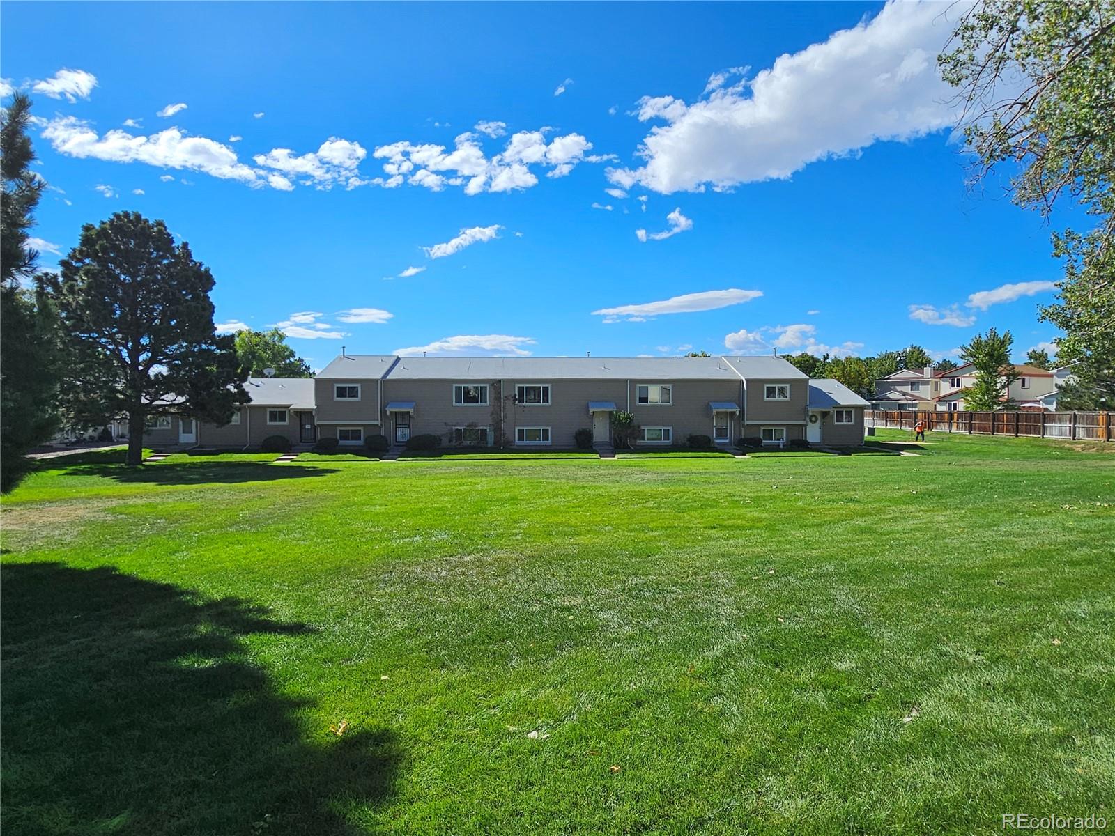 a view of a house with a big yard