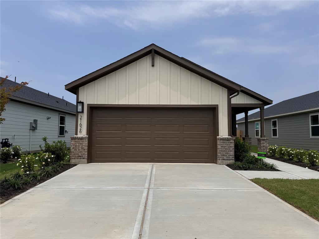 a front view of a house with garage