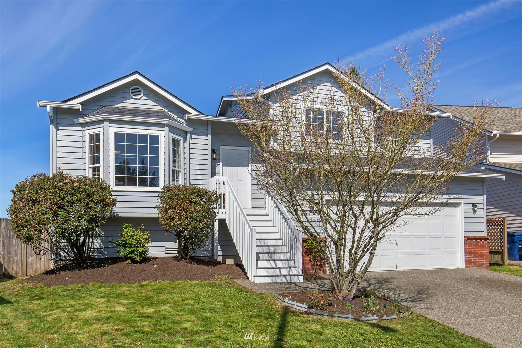 a front view of a house with garden