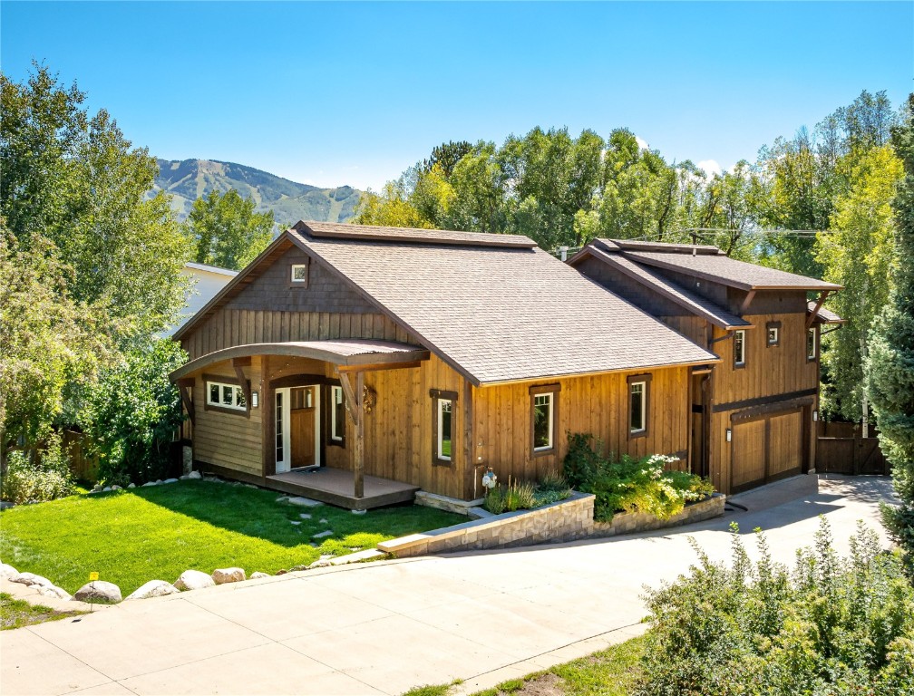 front view of a house with a yard