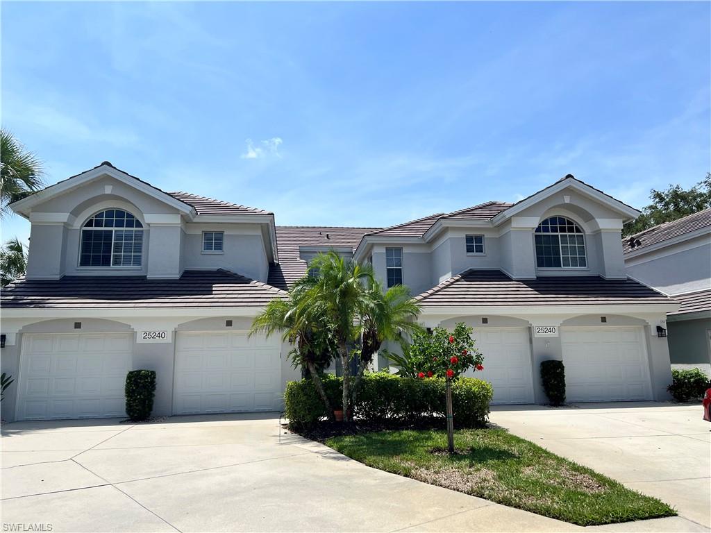 a front view of a house with a garage