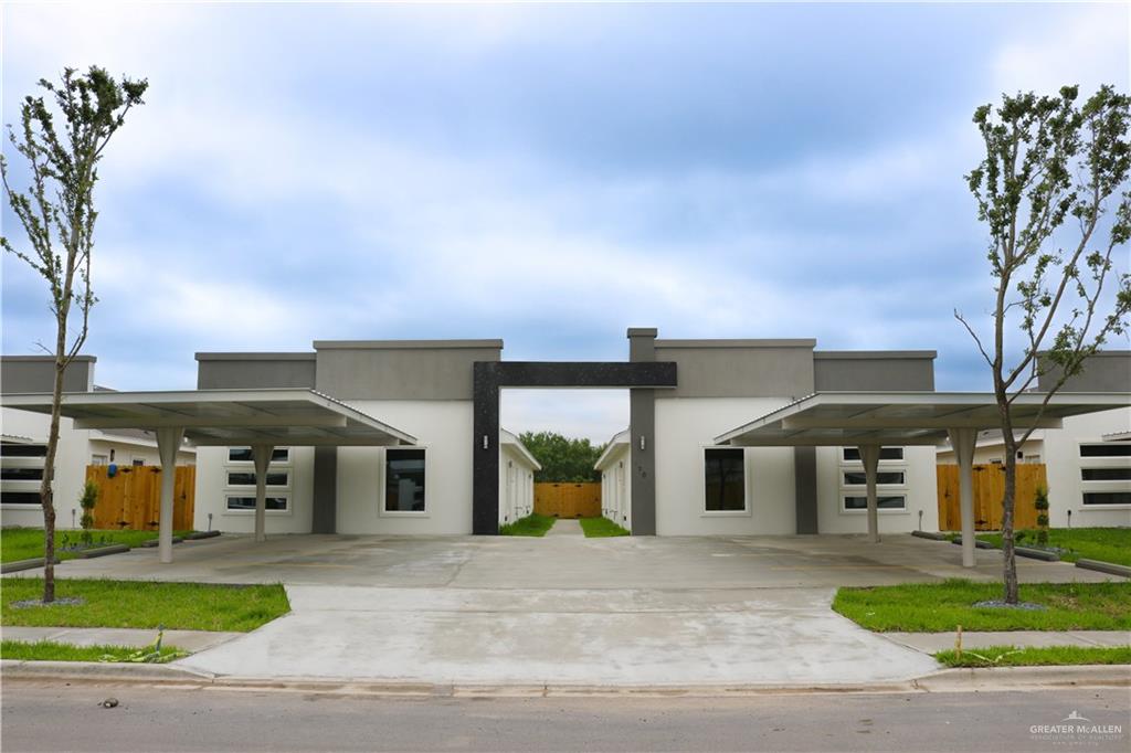 View of front of property featuring a carport