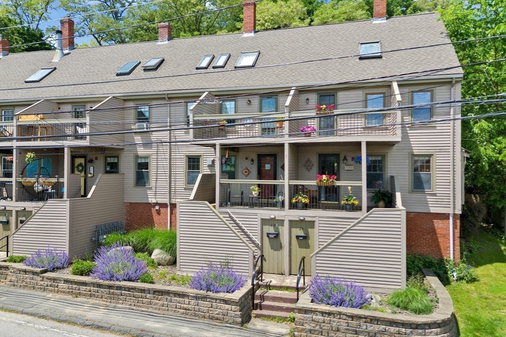 front view of a building with a garden