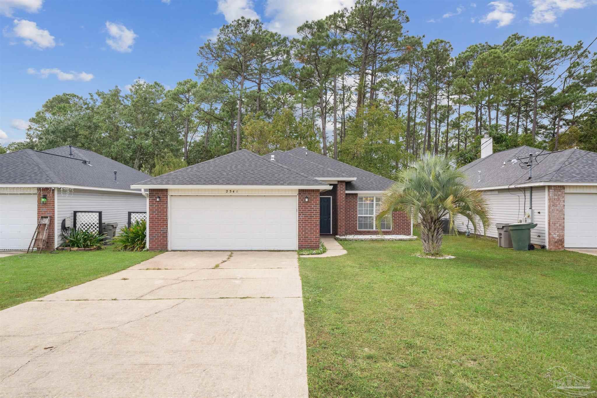 front view of a house with a yard