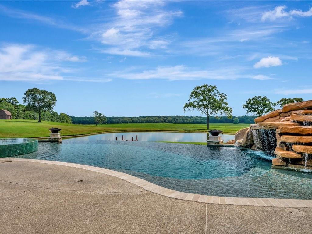 a view of a lake with a house in the background