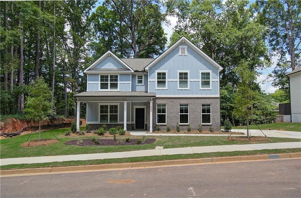 a front view of a house with a yard