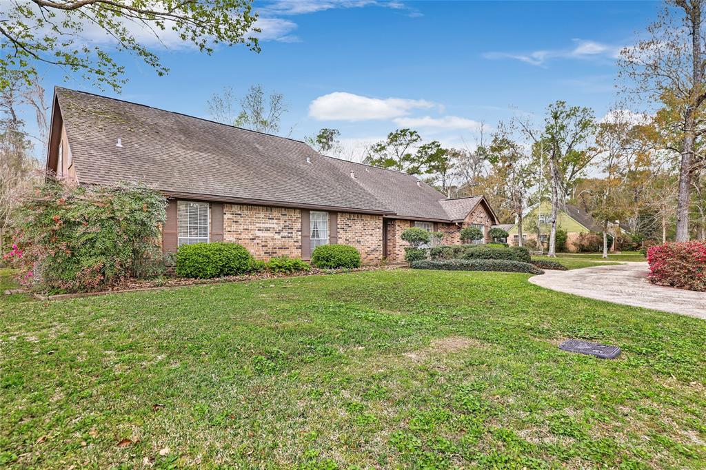 a front view of house with yard and outdoor seating