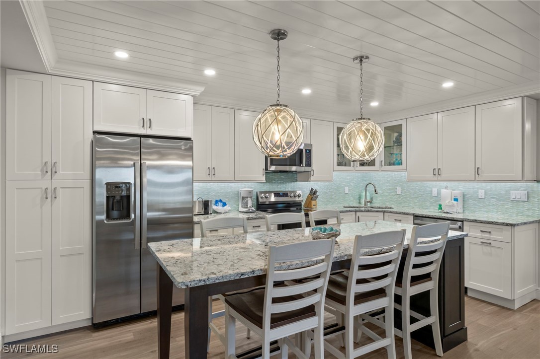 a kitchen with a table and chairs in it