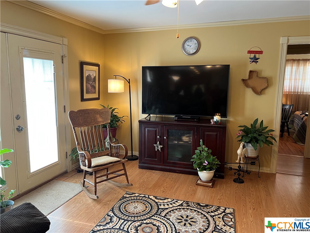 a living room with furniture and a flat screen tv