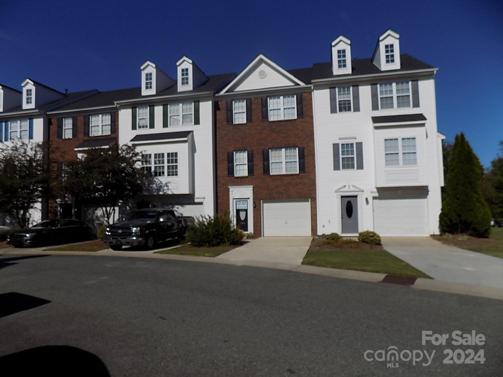 a front view of a house with yard