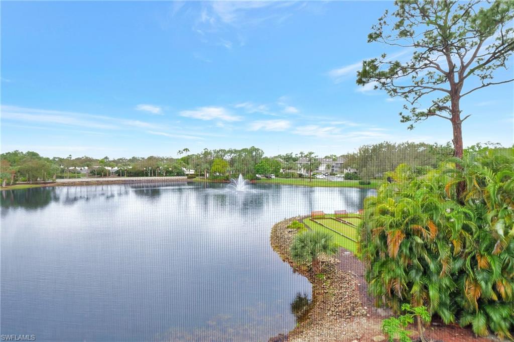 a view of a lake with a house in the background