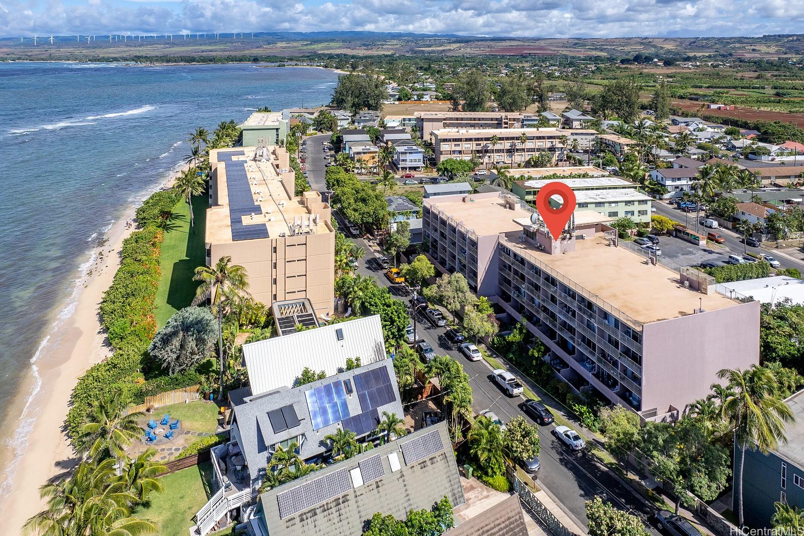 an aerial view of residential houses with outdoor space