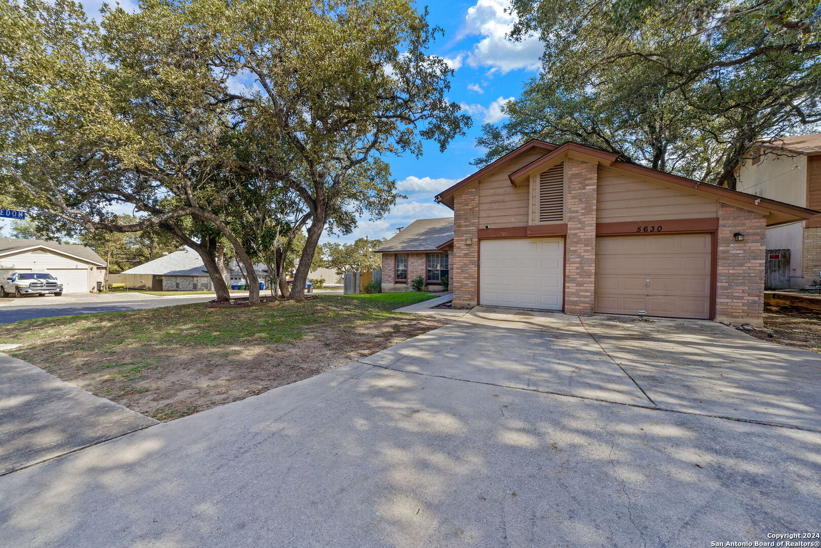 a house with trees in the background