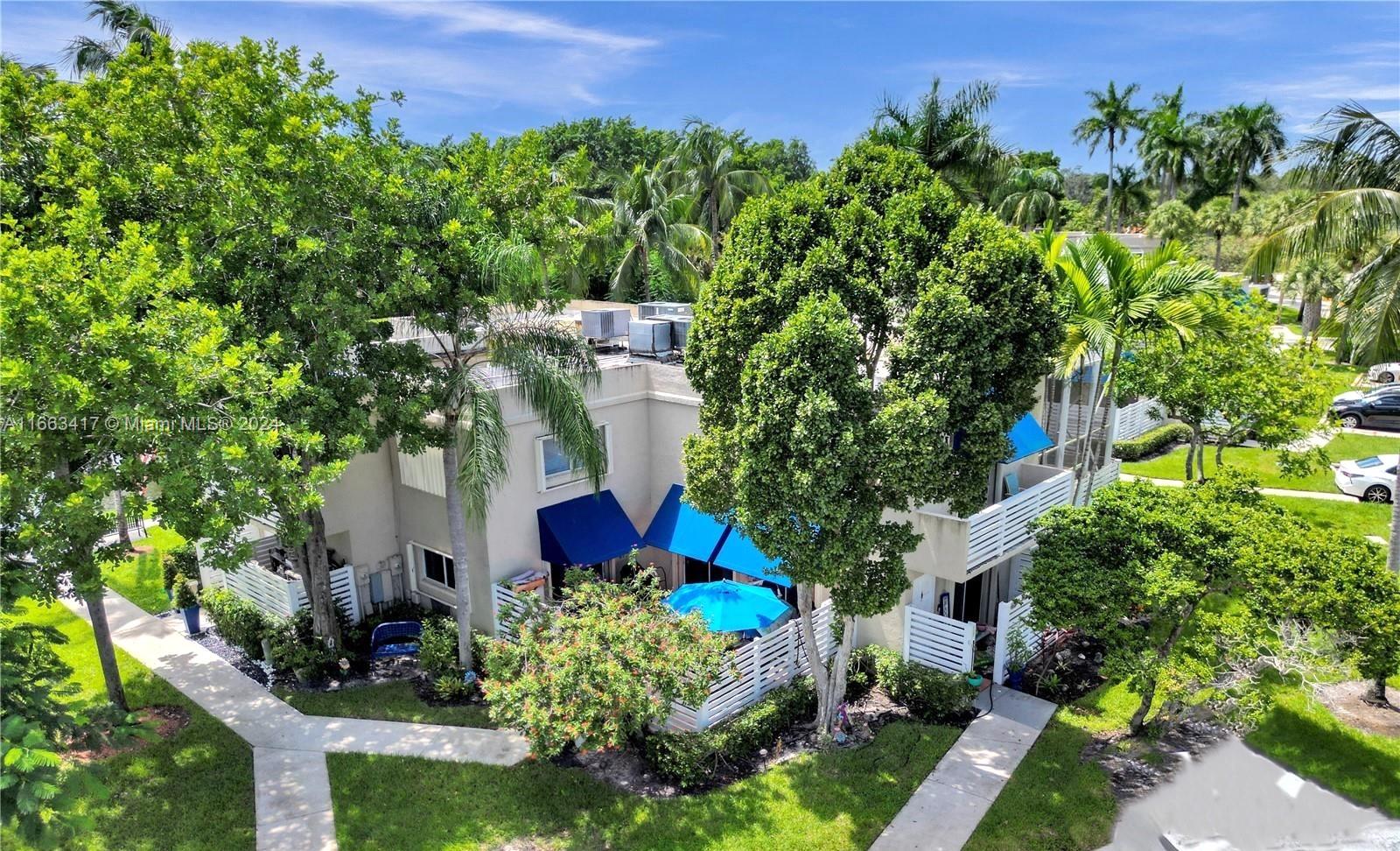 aerial view of a house with a yard and garden