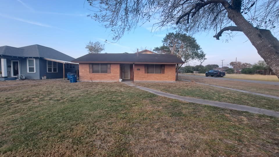 a front view of a house with a yard