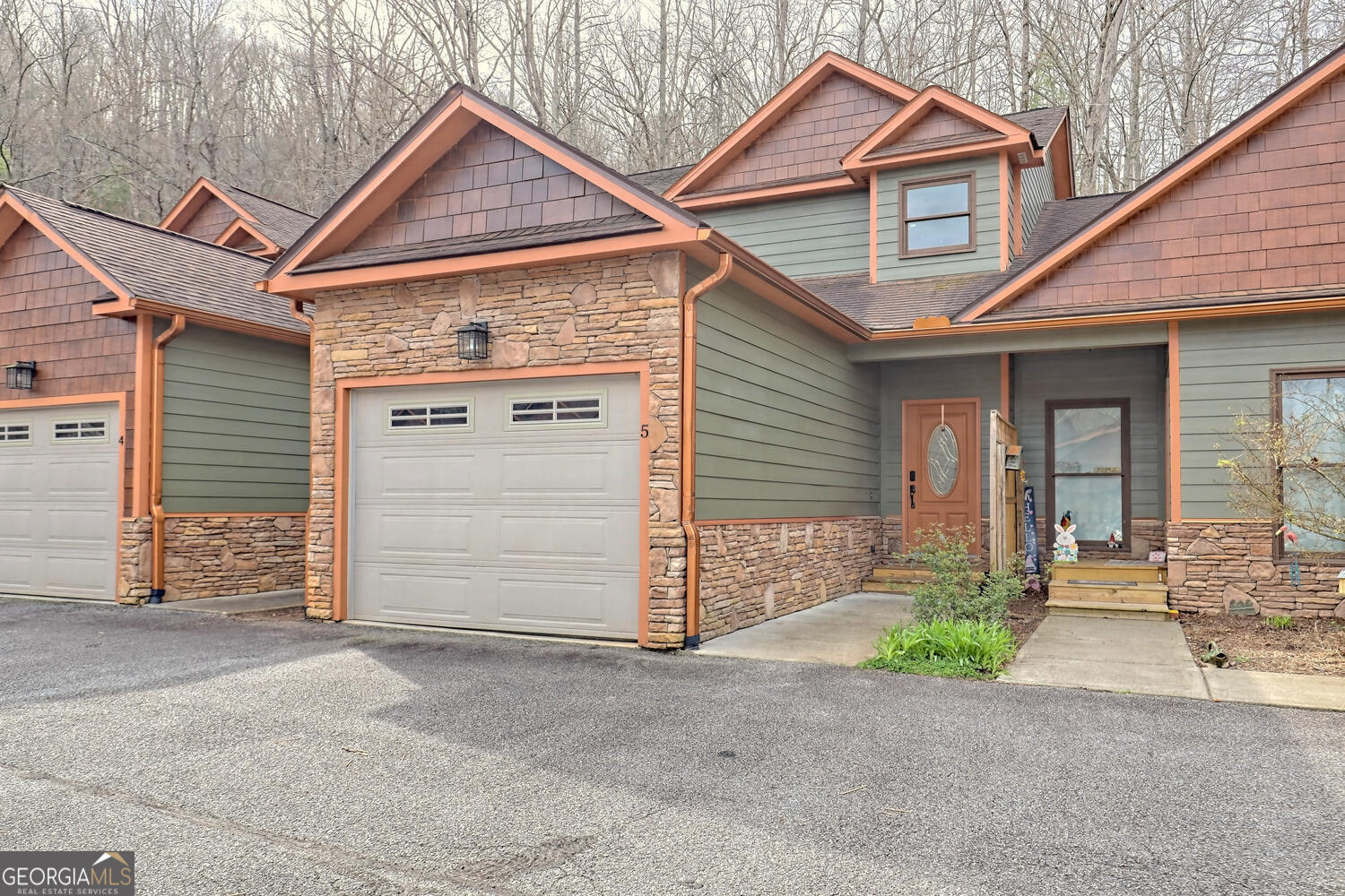 a front view of a house with a garage