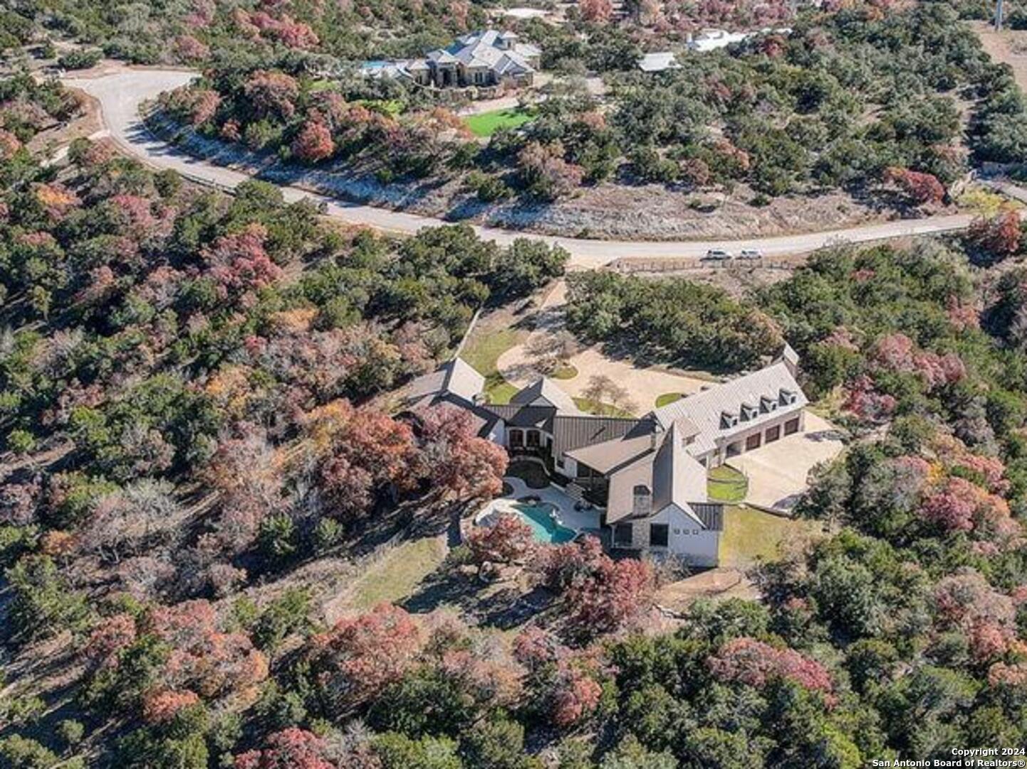 an aerial view of residential house with outdoor space