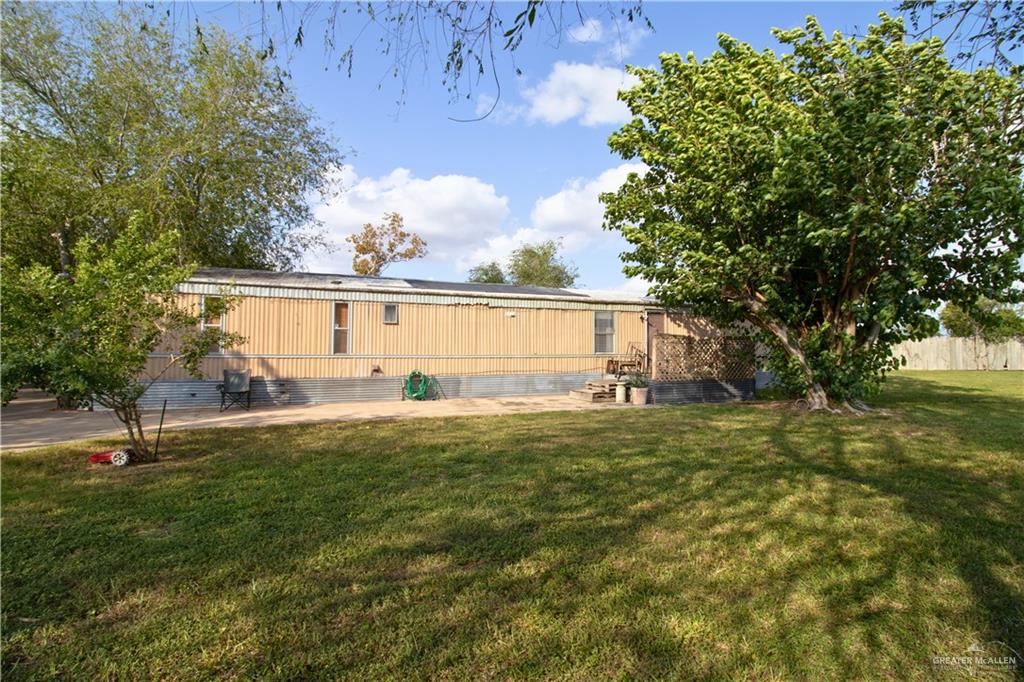 a backyard of a house with lots of green space