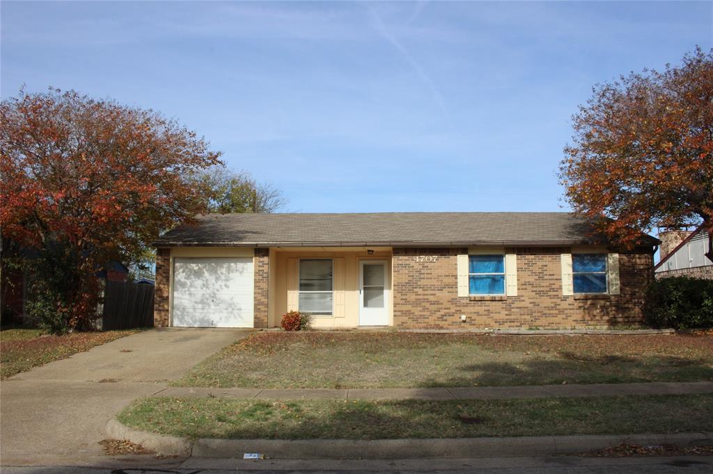 a front view of a house with yard