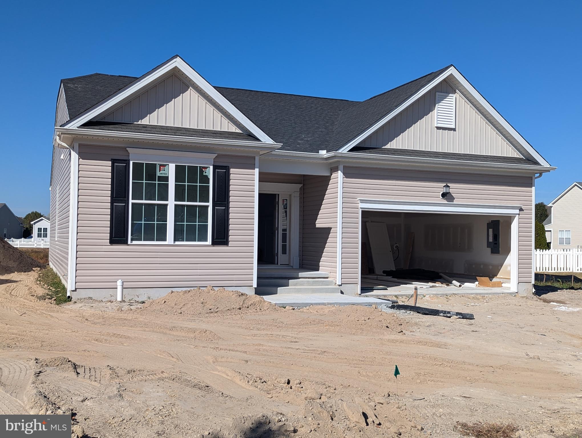 a front view of a house with yard