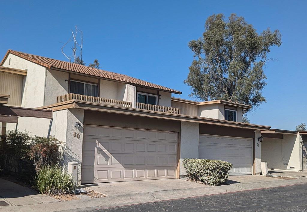 a front view of a house with a garage