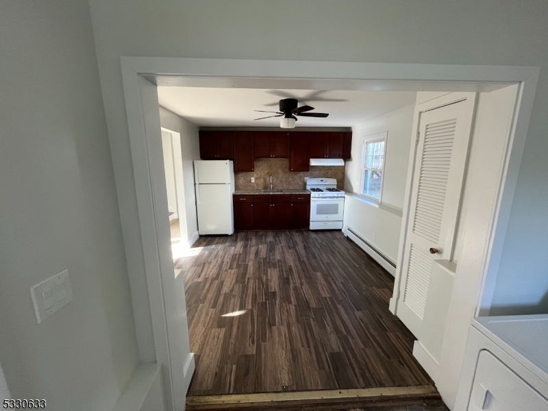 a view of entryway with wooden floor