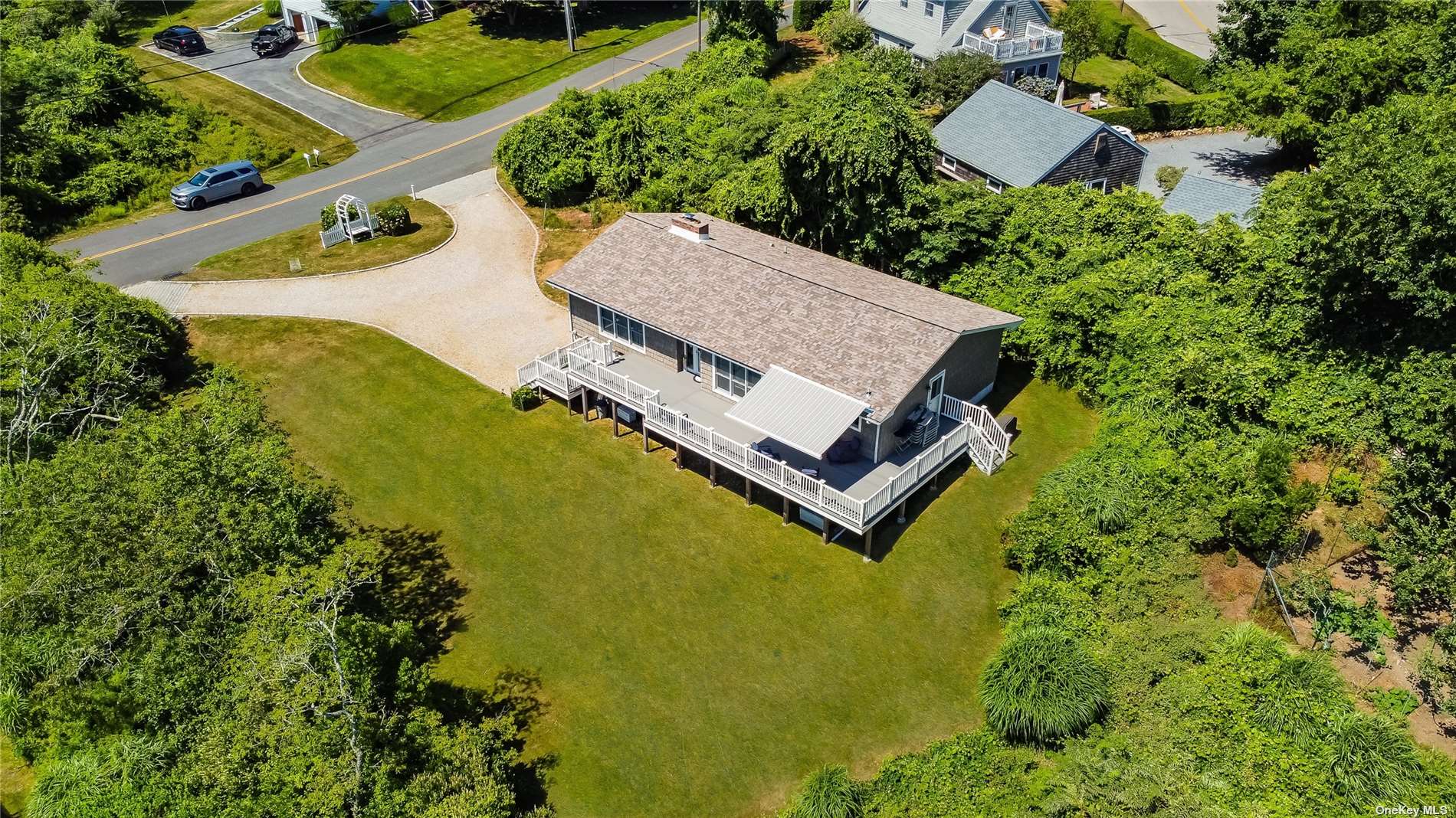 an aerial view of a house with pool yard and outdoor seating