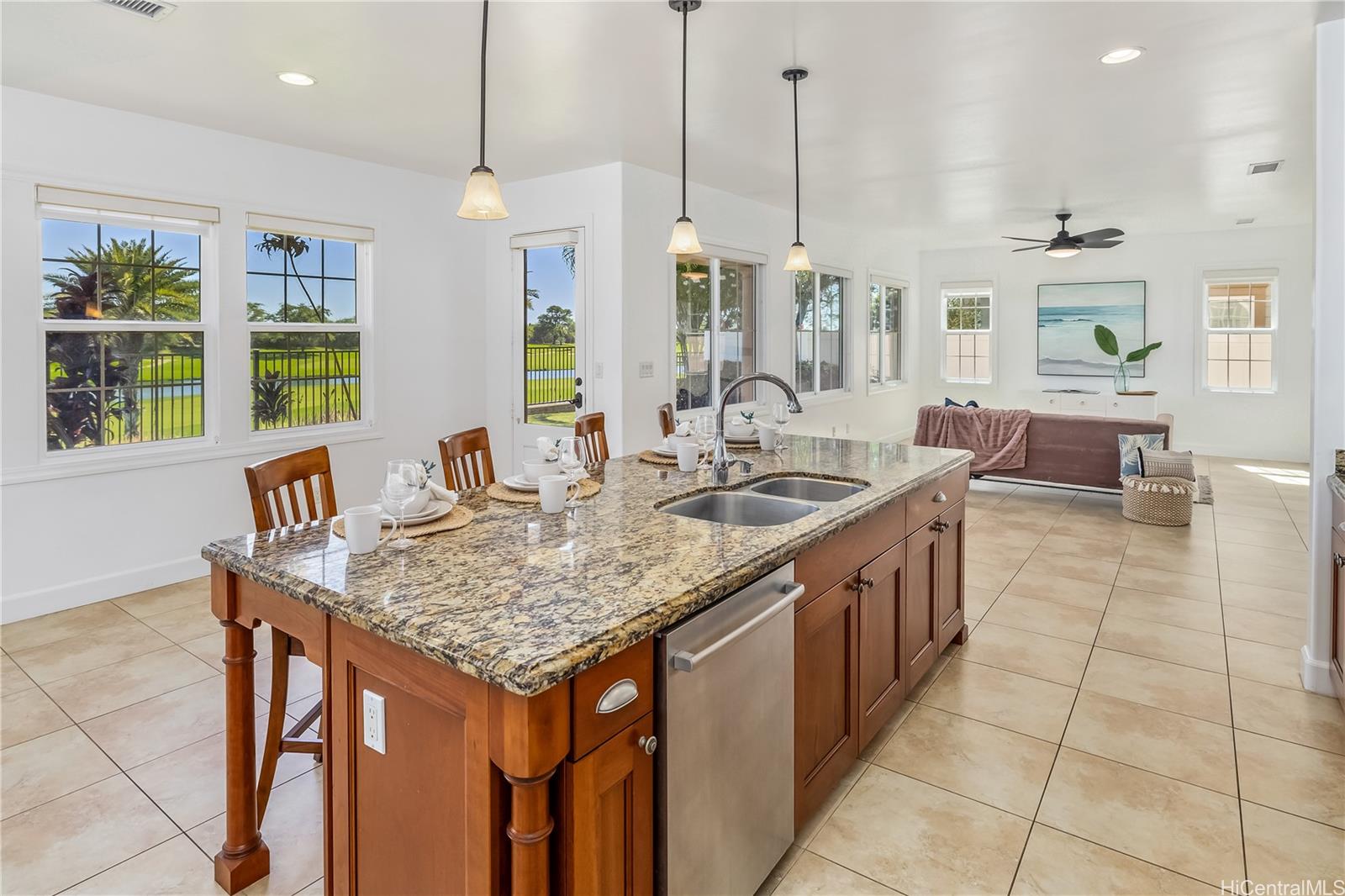 a kitchen with center island table and chairs