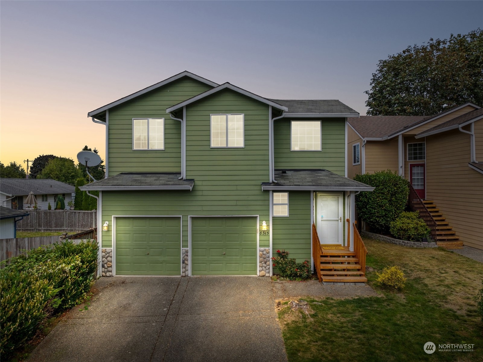 a front view of a house with garage