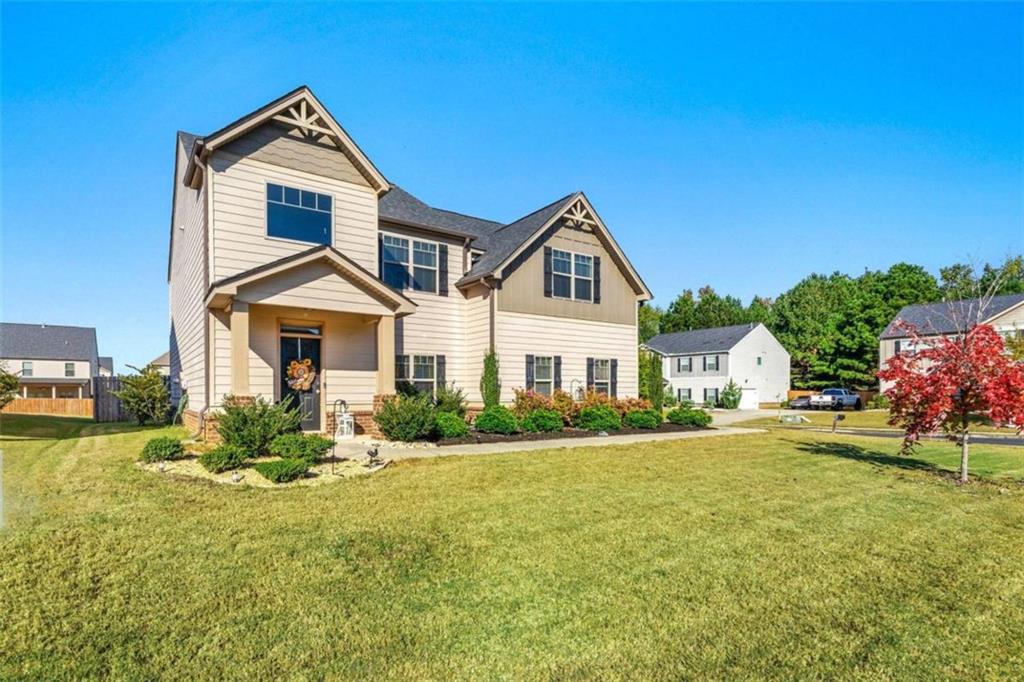 a front view of a house with a yard