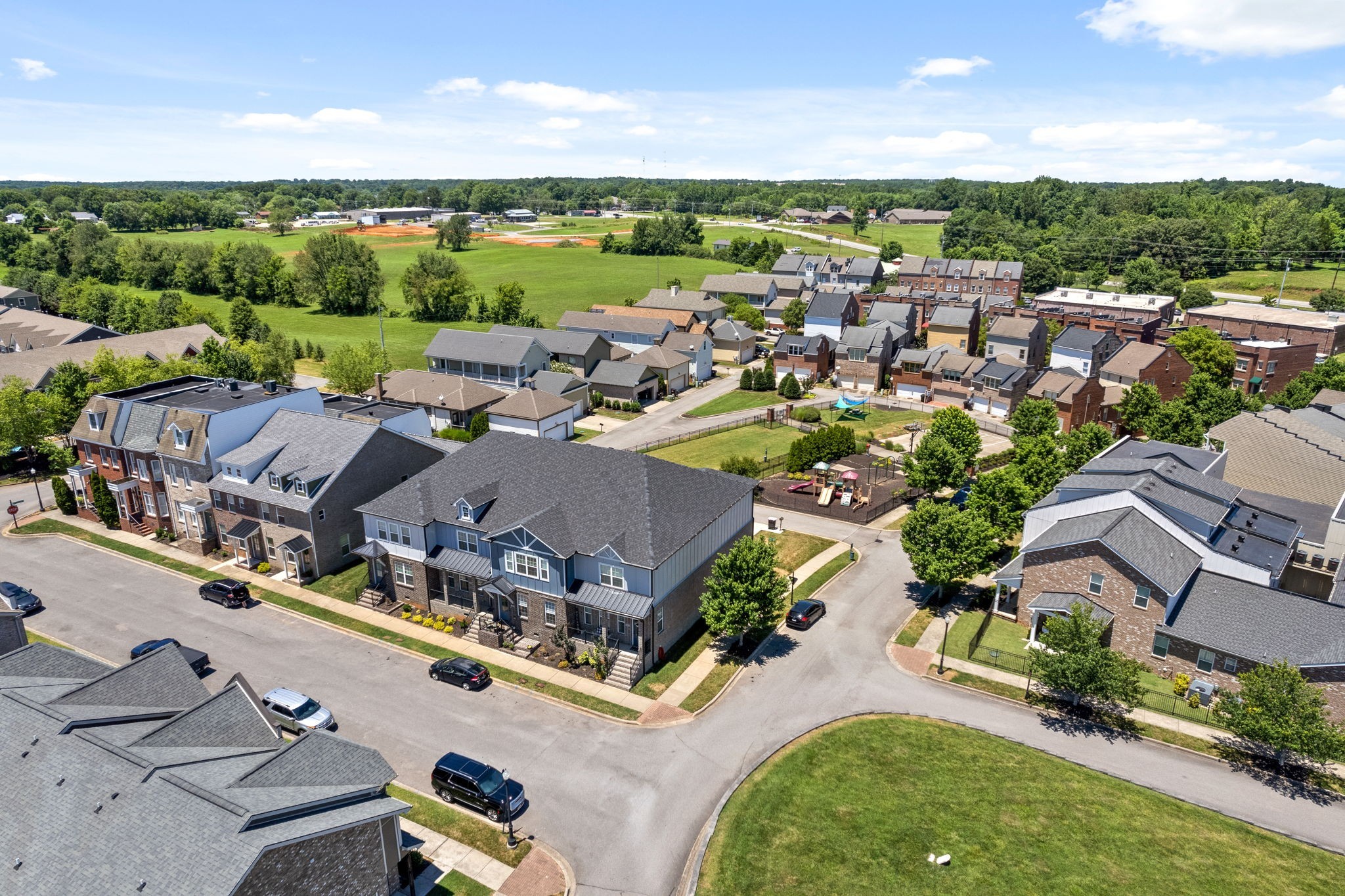 an aerial view of a house with outdoor space