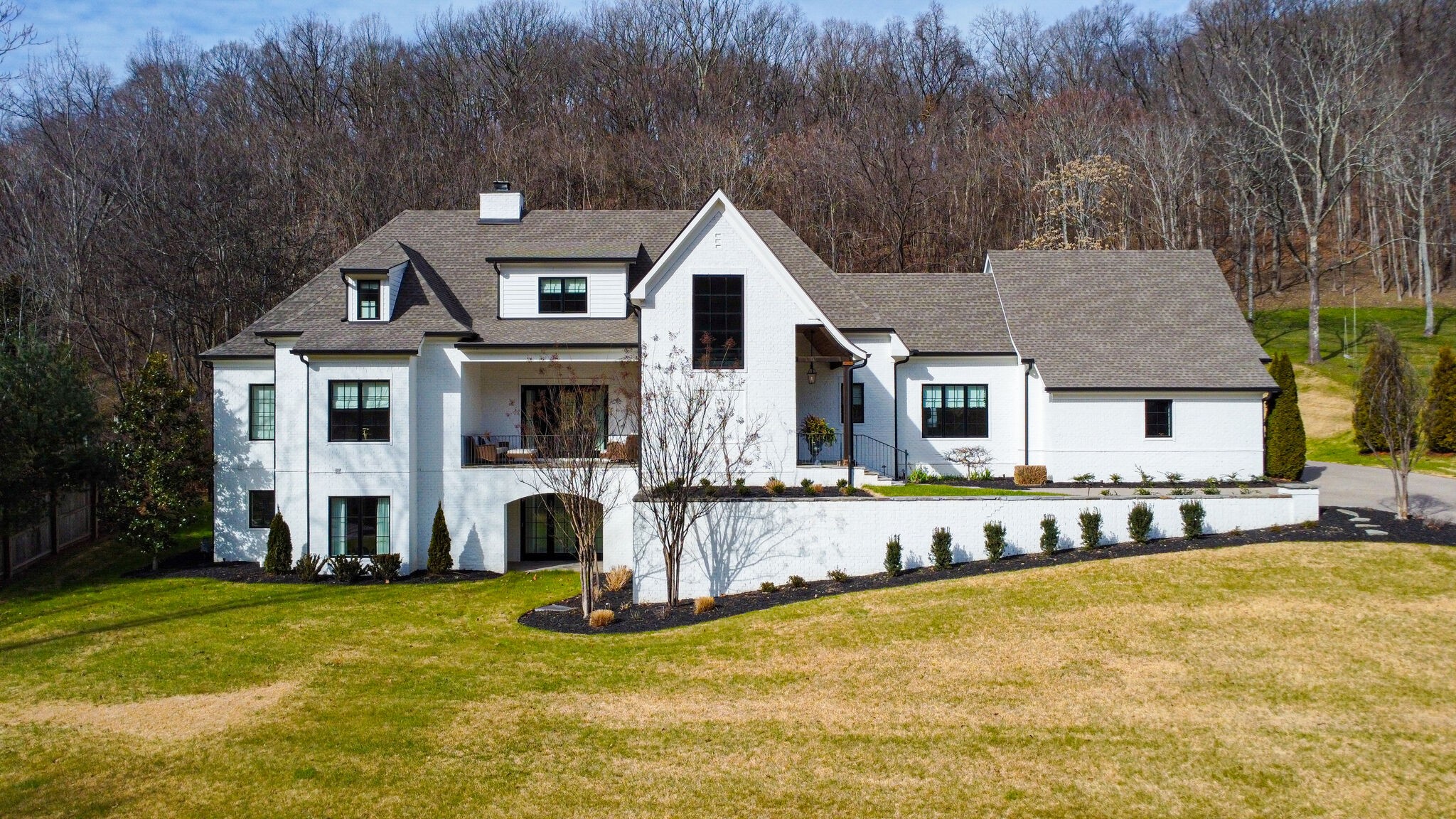 a front view of house with yard and swimming pool