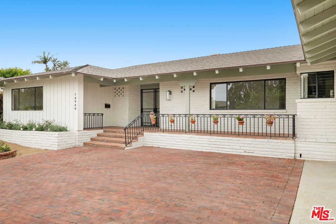 a view of a house with deck area and balcony