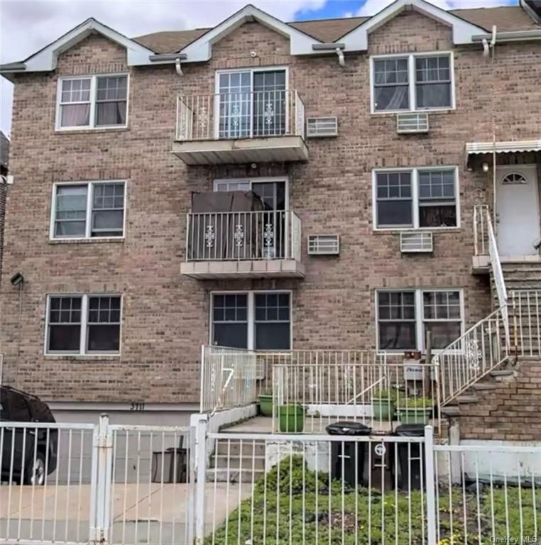 a front view of a house with a fence