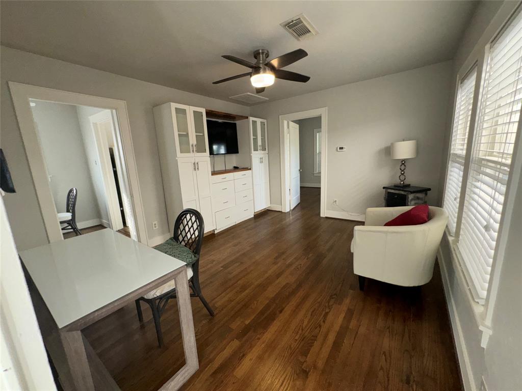 Beautiful, newly refinished hardwood floors greet you as you enter the apartment into this well lit, vast living room.  Recent ceiling fans. ll windows have 2" faux wind blinds.