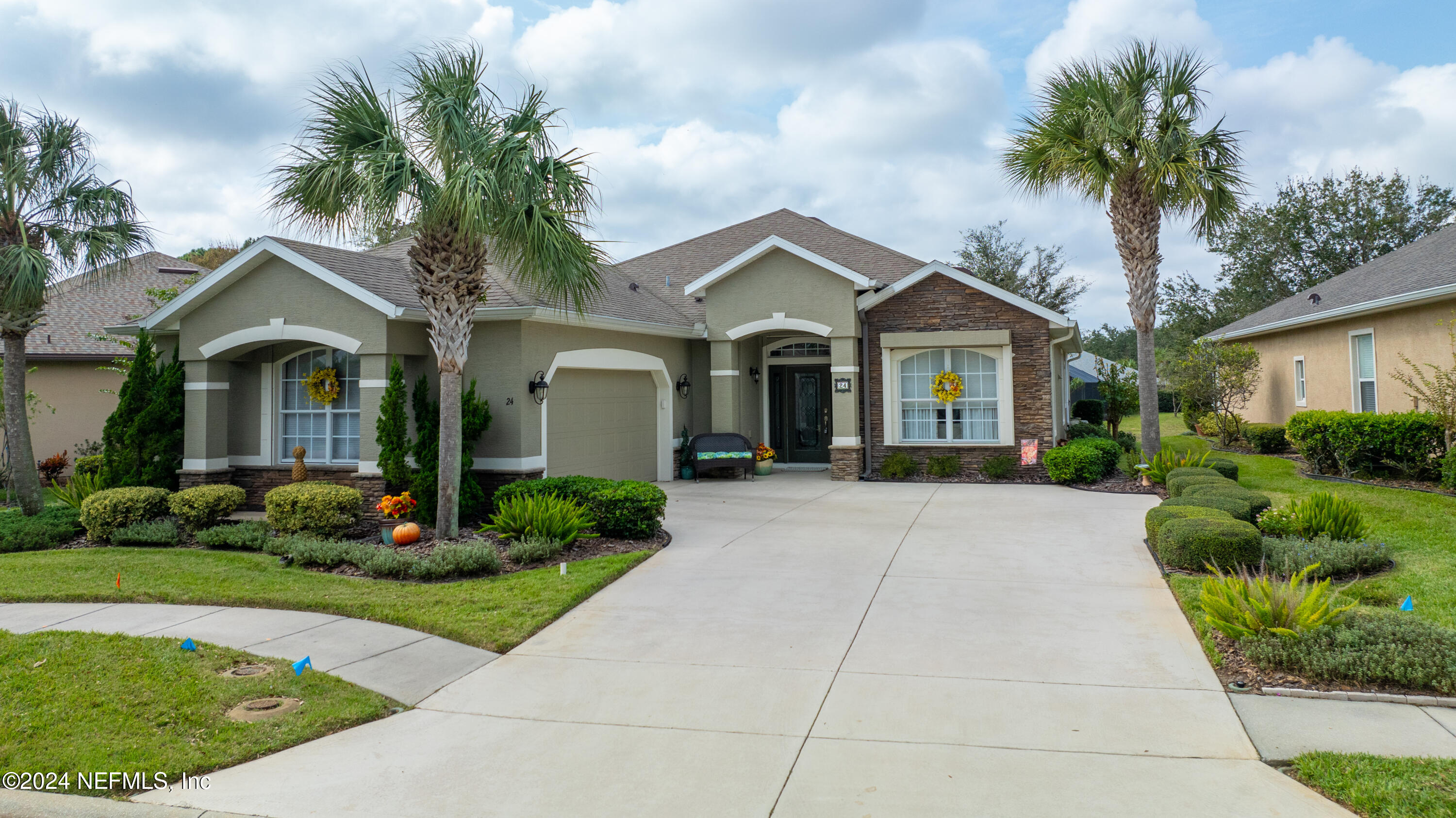 a front view of a house with garden