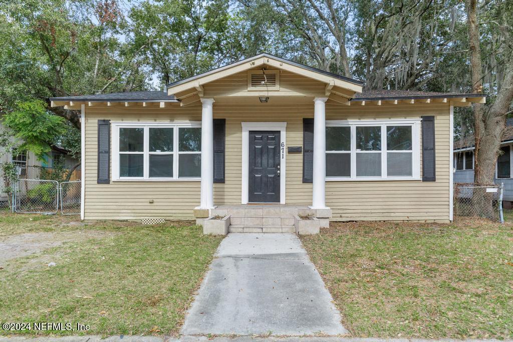 front view of a house with a yard