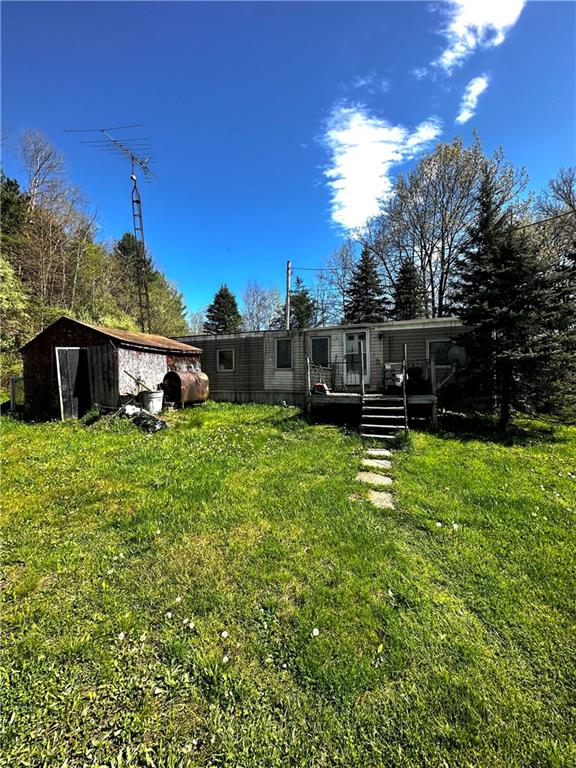 a view of a house with a big yard