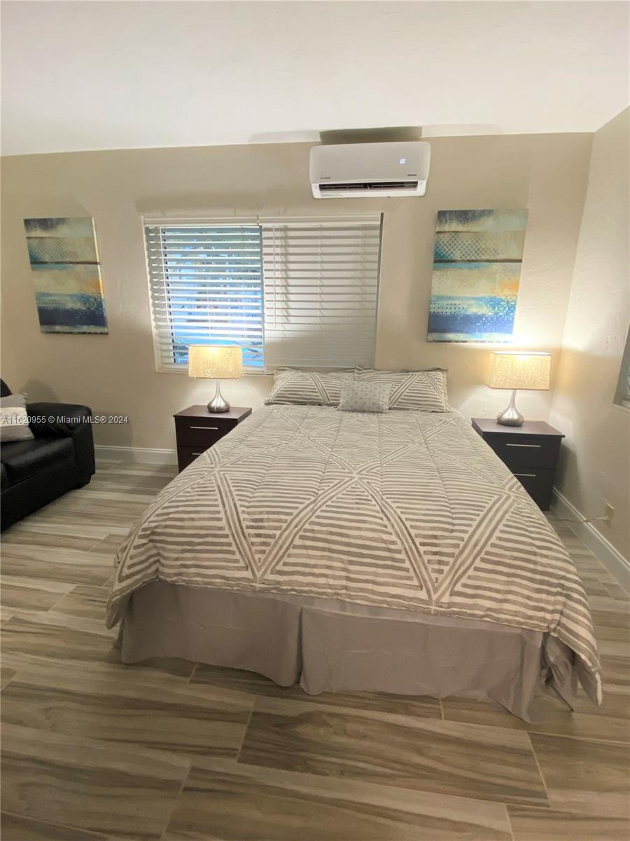 a large white bed in a small room