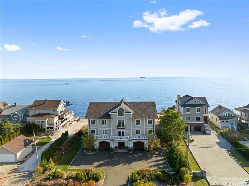 an aerial view of a house with a big yard