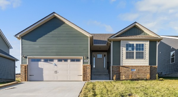 a front view of a house with a garage