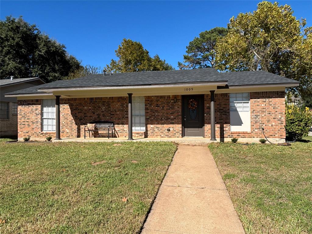 front view of a house with a yard