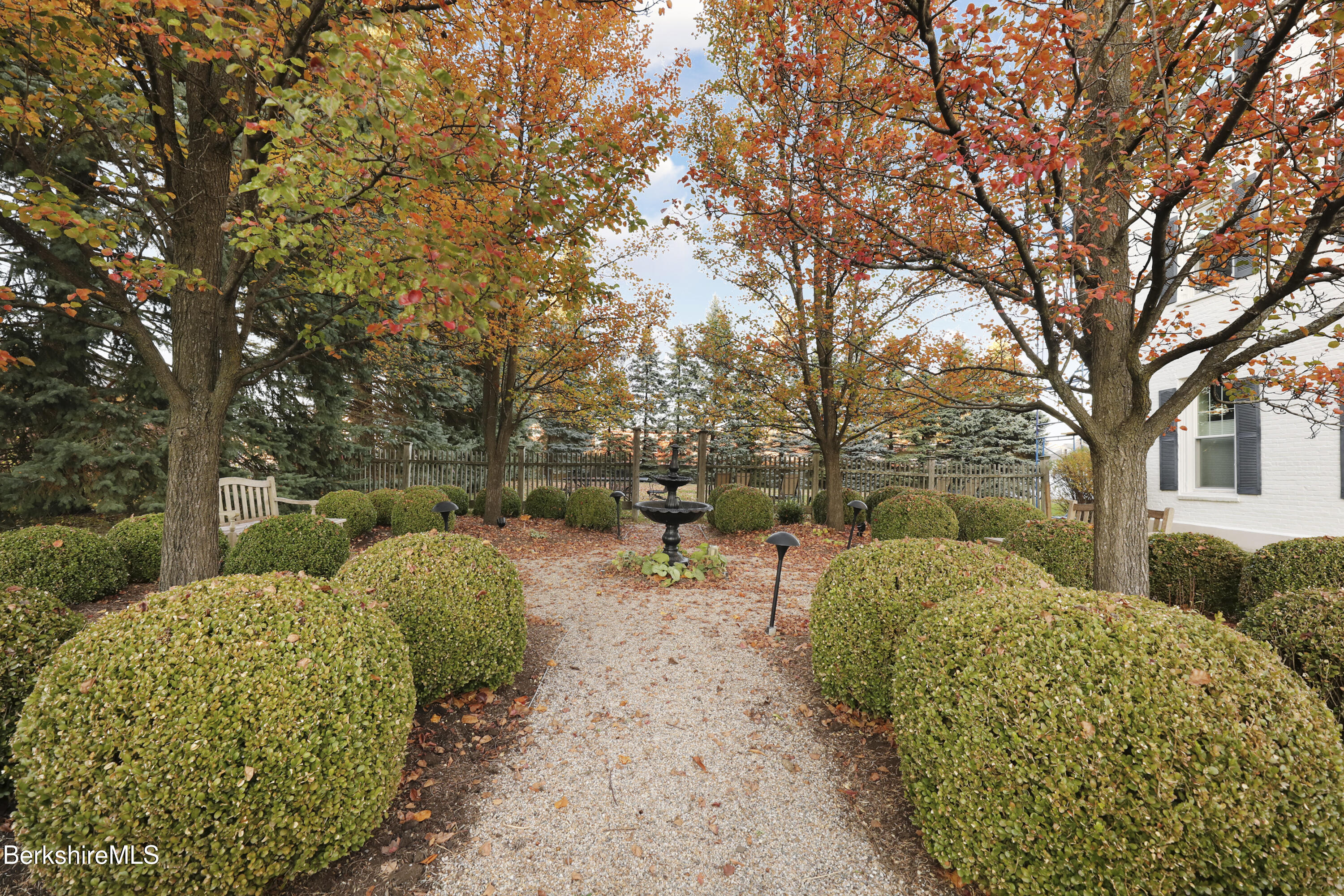 a view of a backyard with sitting area