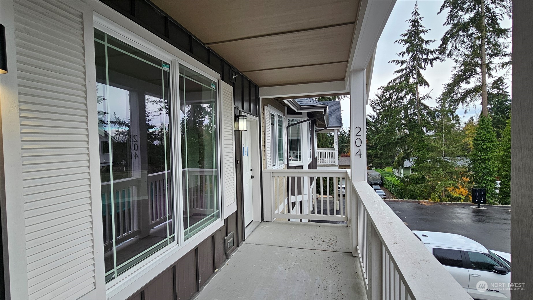 a view of balcony with furniture and garden